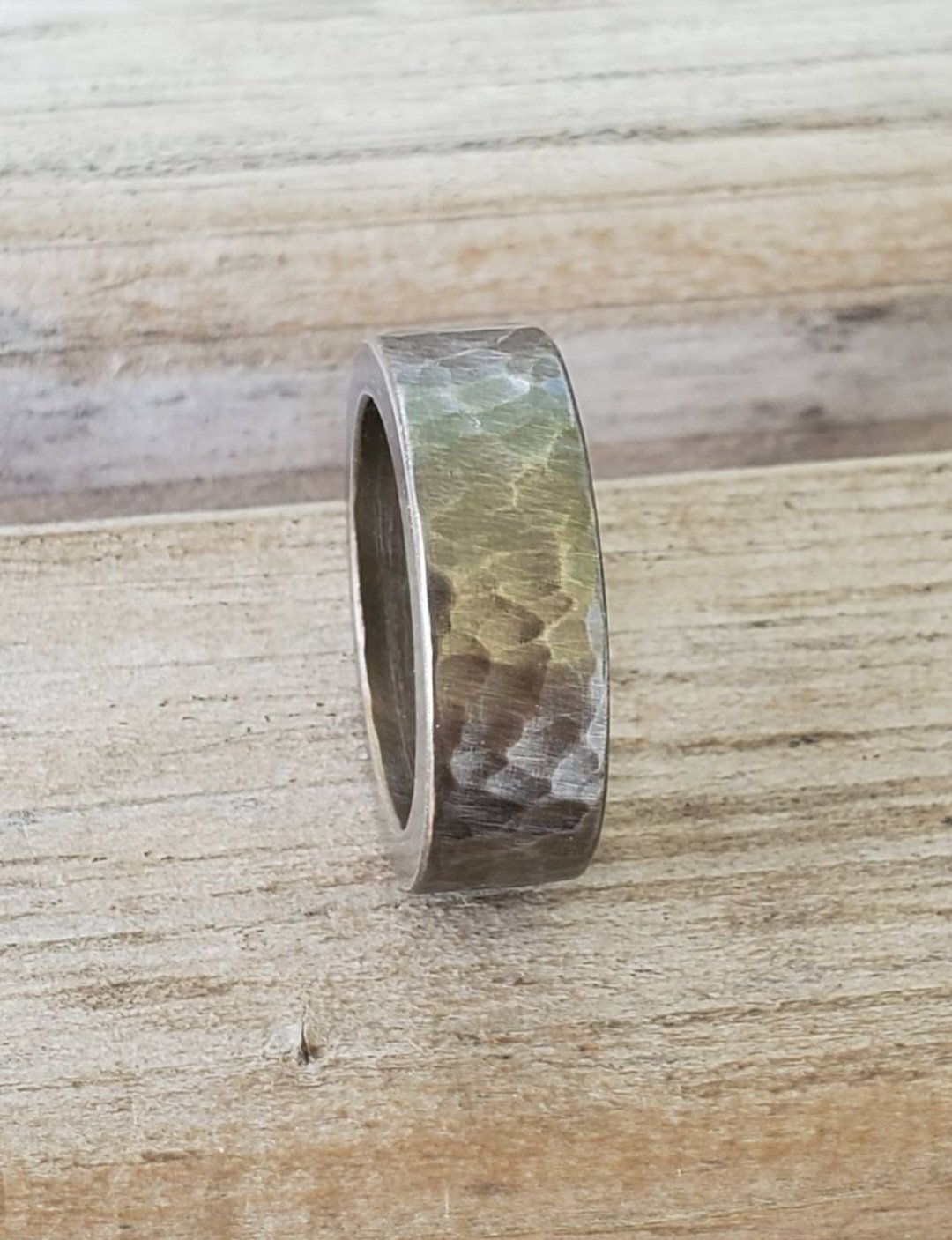 Hammered and Darkened Stainless Steel Rings with darkened steel throughout the piece