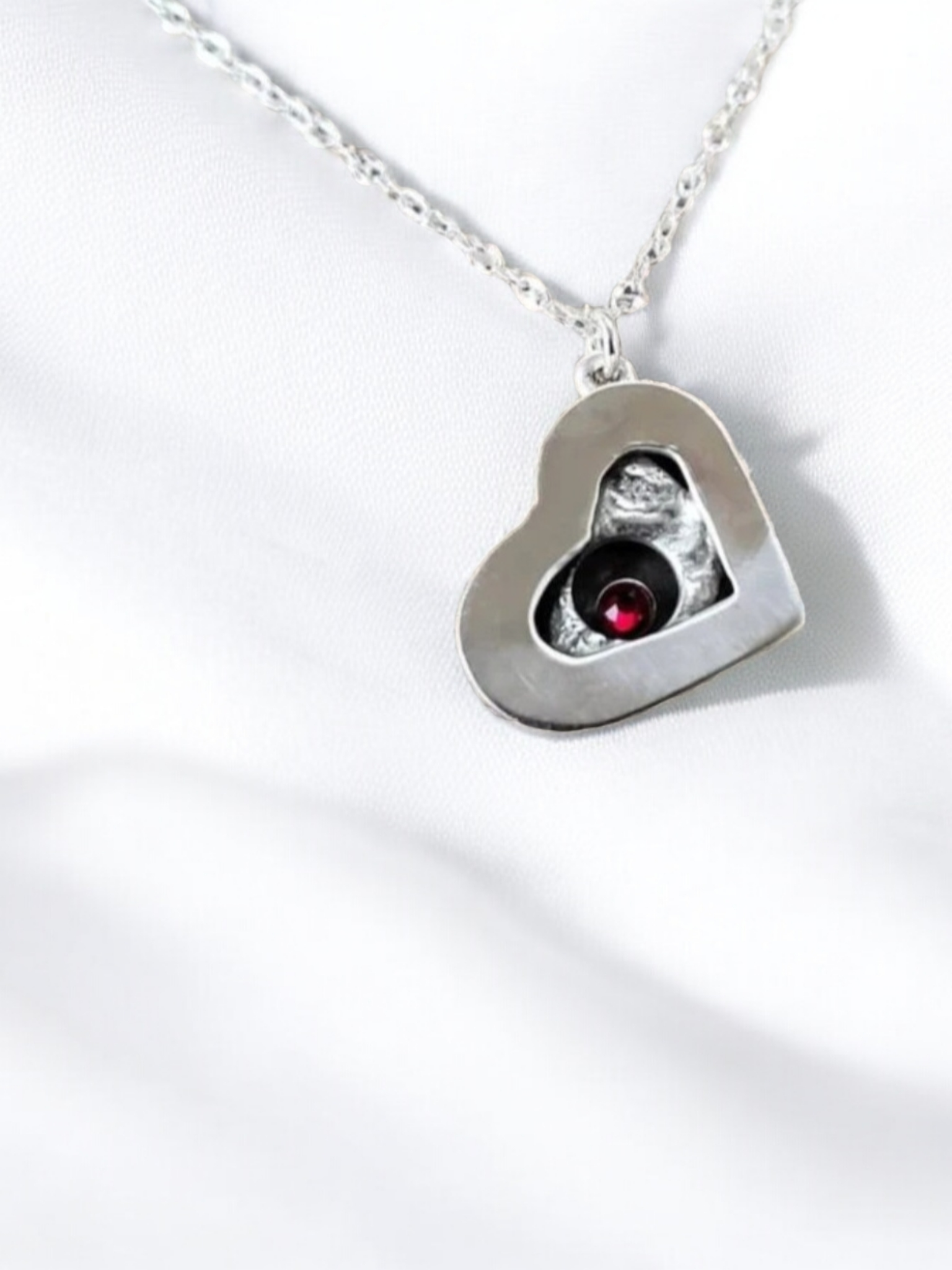 Garnet Heart Pendant Sterling Silver Necklace on a white background