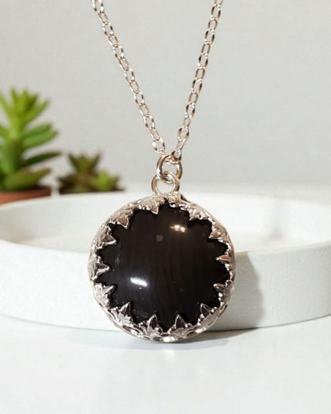 Sterling Silver Black Agate Cabochon Necklace showing the crown bezel setting with intricate details.