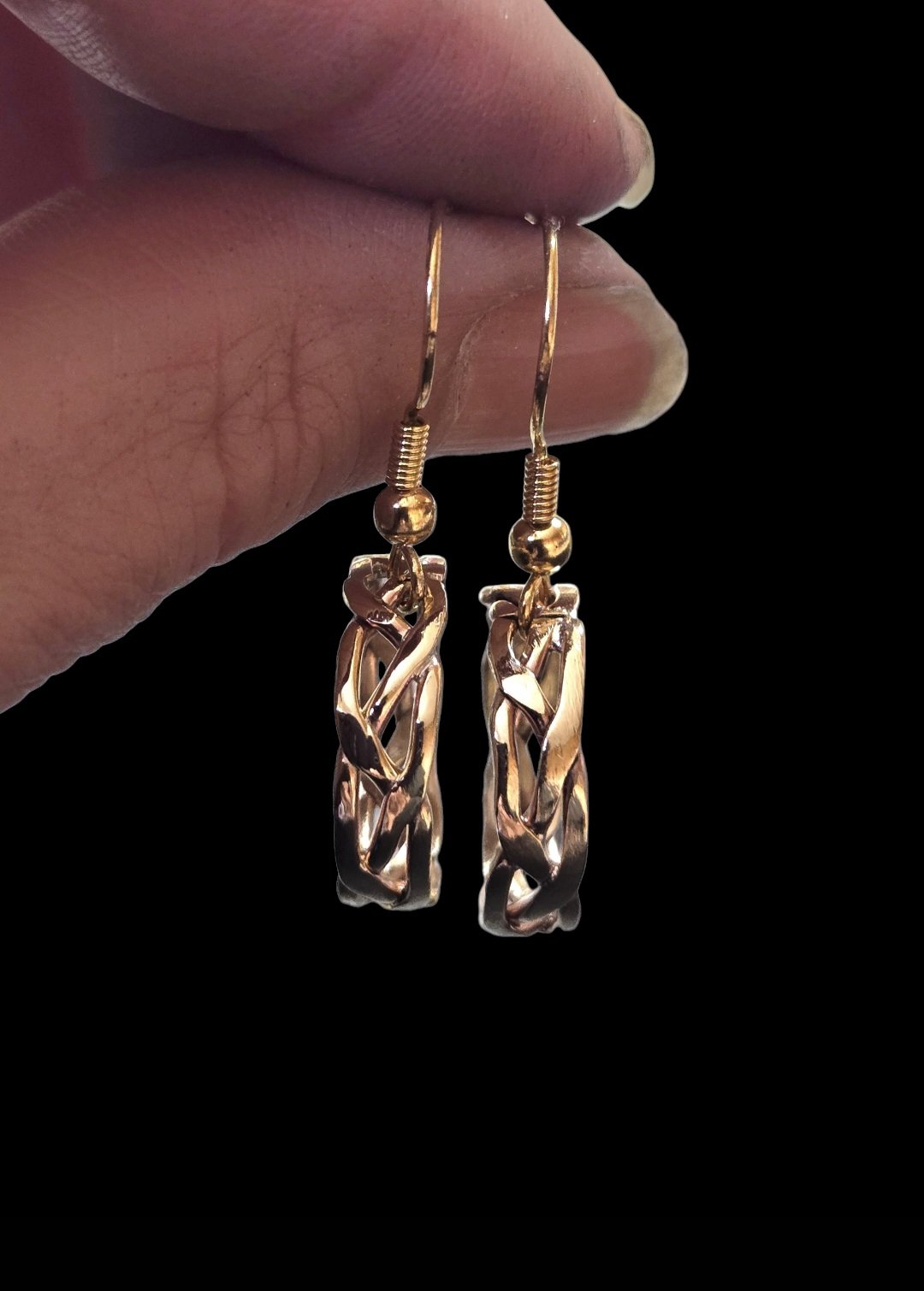 Braided Jeweler's Brass Round Earrings on French wire held by model's hand